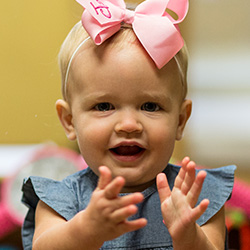 Toddler girl clapping hands